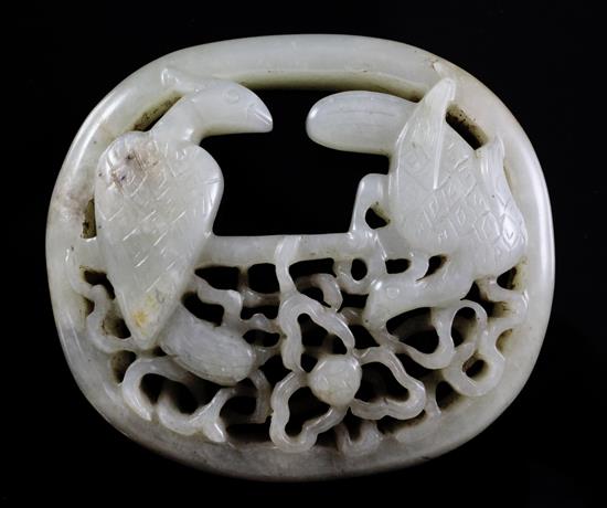 A Chinese pale celadon jade oval plaque, probably 17th / 18th century, 7.3cm